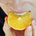 Girl Eats Sour Lemon